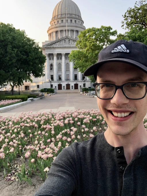 A photo of Tim Williamson in front of the capital building in Madison, Wisconsin