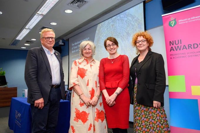 Prof Chris Williams, Prof Claire Connolly, Dr Máirín MacCarron and Dr Helena Buffery with the NUI Awards banner