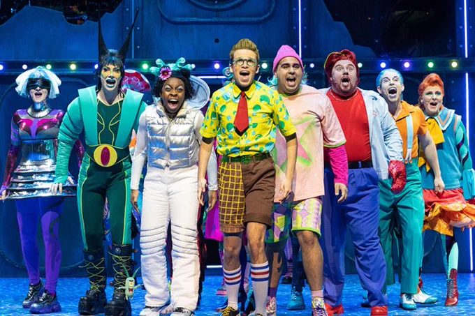 The cast of Spongebob stand and sing together