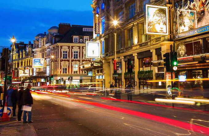 The West End lit up at night 