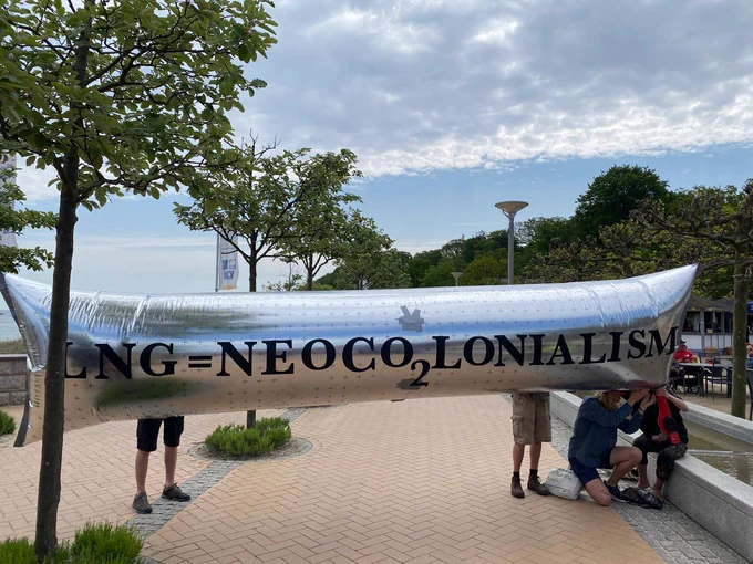 Inflatable pipeline with caption LNG = NeoCO2lonialism