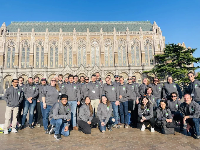 A group of developers at eScience Institute, wearing gray hoodies with the Scientific Python logo.