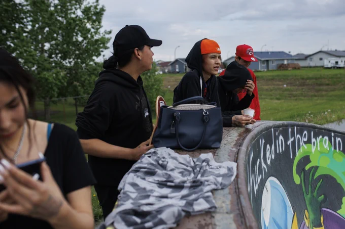 Seanna Fryingpan with her cousins and brother at the skateboard park on Ermineskin 138 reserve in Maskwacis, Alberta, June 7, 2022.