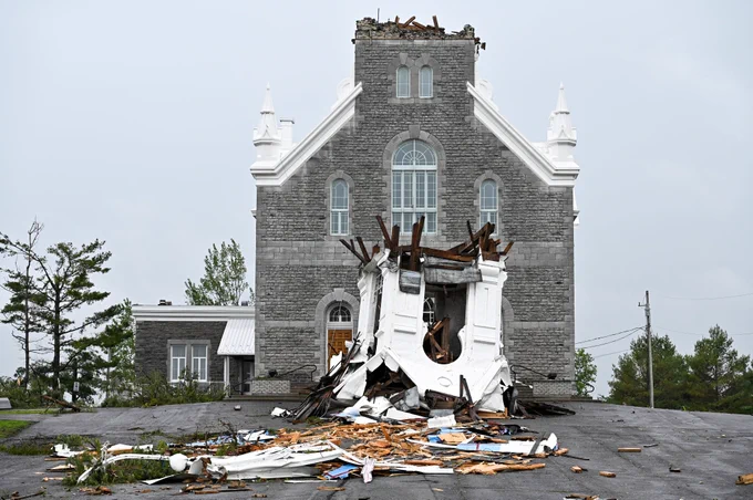 Damage is seen to the steeple of the historic Paroisse Saint-Hugues church in Sarsfield, Ont. on Sunday, May 22, 2022 following a powerful ‘derecho’ storm which killed 11 and damaged dozens of buildings across the region.