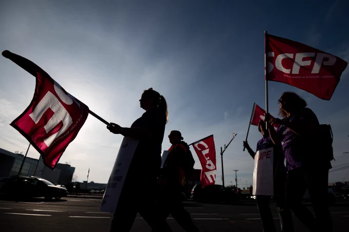 CUPE members and supporters join a demonstration in the east-end of Ottawa, Ont., on Friday, Nov., 4, 2022. THE CANADIAN PRESS/Spencer Colby