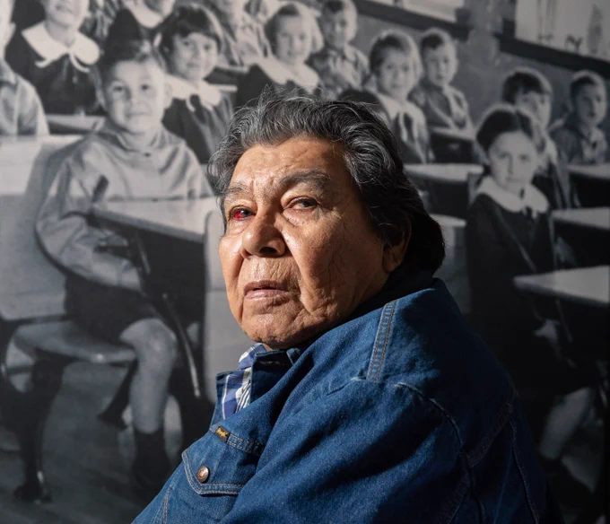 Residential and day school survivor Charlie Bittern poses for a photo at the Human Rights Museum in Winnipeg at the residential schools display on September 23, 2022. He entered the day school system in Berens River, Manitoba, at 7 years old where he was not allowed to speak his language of Saulteaux. When he was 10, his day school teacher hit him on the right side of his temple with a yardstick because he was late coming back to school from lunch and he took out the wrong textbook during the lesson. Bittern now takes medication daily to help him with his weak eye which was caused during the hit. He spent eight years at day school during his elementary years and four years in residential school during high school. In 1967, Bittern, then 19, was forced to run 80 kilometres through a November snowstorm by the principal of his residential school from Bagot, Manitoba, to Brandon, Manitoba. He still has scars on his right leg from a station wagon driving into him when he dodged snow drifts.
