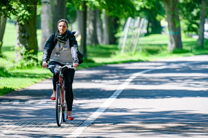 Person commuting to work on a cycle path