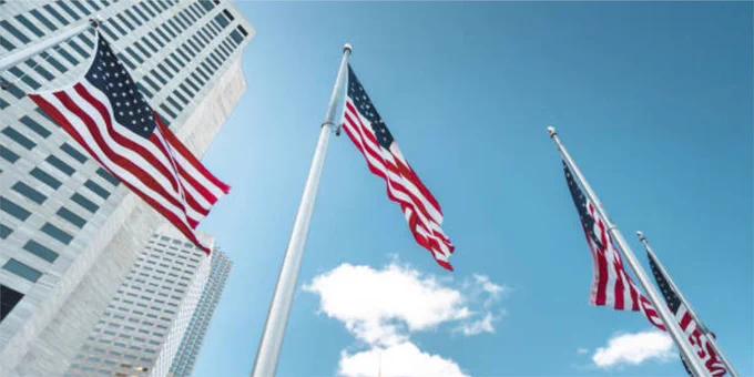 A row of American Flags wave in the wind in Downtown Miami.