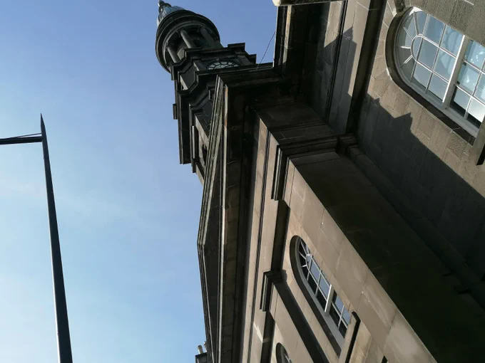 A view of the Queen's Hall at a jaunty angle looking towards the sky