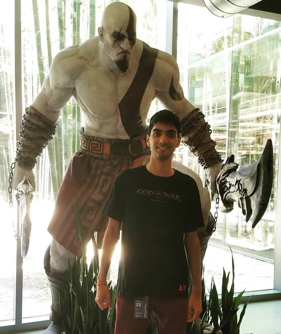 Me in 2018 in front of a classic Kratos statue