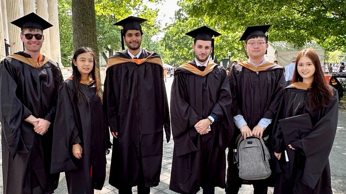 Master in Finance graduates preparing for the hooding ceremony