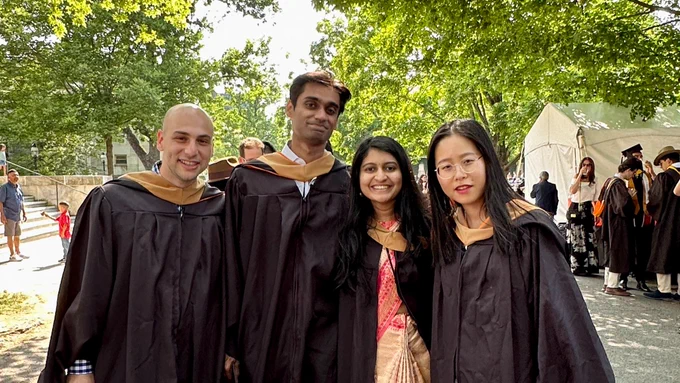 Master in Finance graduates preparing for the hooding ceremony