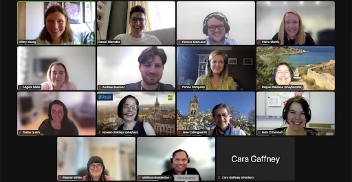 Screenshot of a zoom meeting with 15 people. 14 people have their cameras on. 