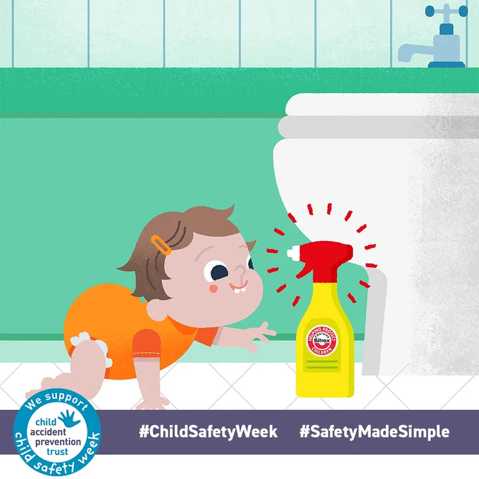Crawling child reaching for a cleaning product next to the toilet