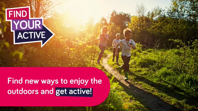 The image shows three children running on a path in the woods with the sun setting.