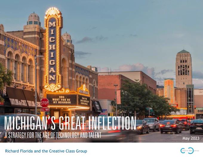 The cover of a report with a photo of downtown Ann Arbor, Michigan, with the Michigan Theater marquee in the foreground and the Univ. of Michigan's Burton Memorial Tower in the background. The report title reads: Michigan's Great Inflection: A Strategy for the Age of Technology and Talent. 