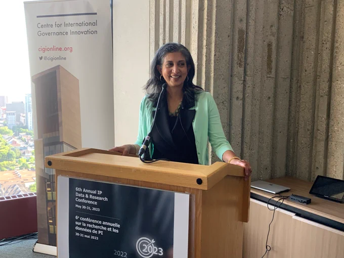 Neena Kushwaha, Chairperson of the Patent Appeal Board, smiling at podium.