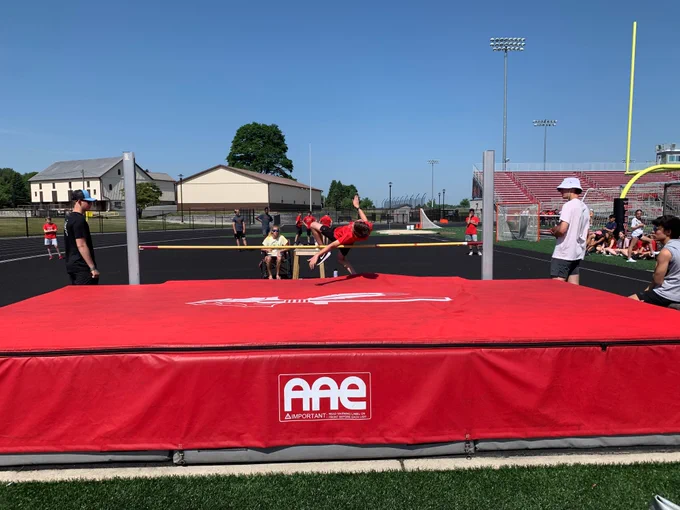 student participating in the high jump event