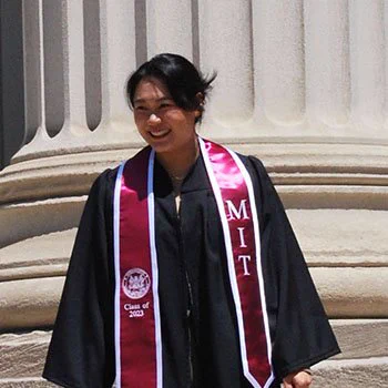 woman wearing gown and MIT stole