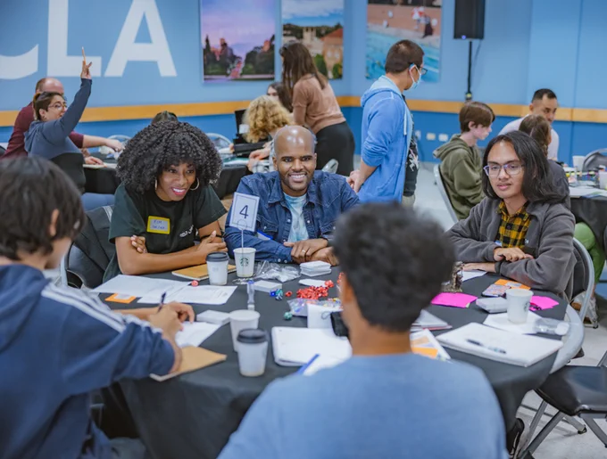 Game Pathways instructors Nick and Kimelia Weathers-Smith speak with students at an "industry speed dating" event at UCLA 