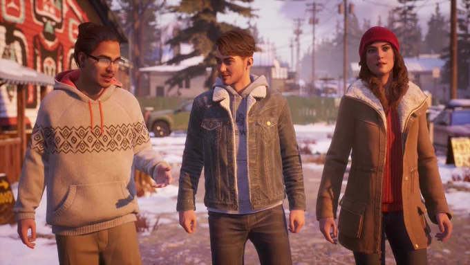 Three friends walking together and smiling in a snowy residential area.