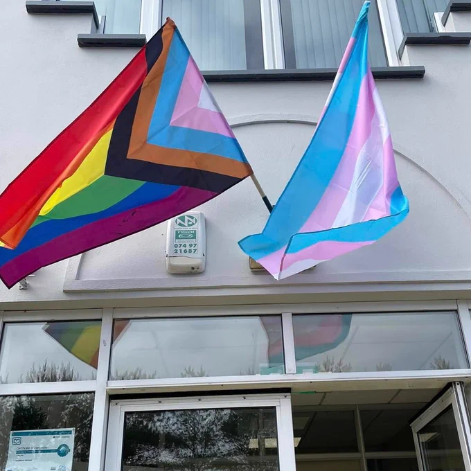 Pride and trans flags.