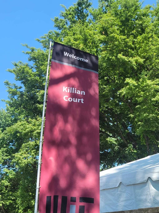 A crimson banner that reads, “Killian Court.”