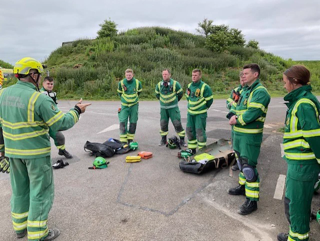 A picture of a briefing sessions ahead of the training session  where Hazardous Area Response Team medics are practised the rescue of a patient from a collapsed building. 