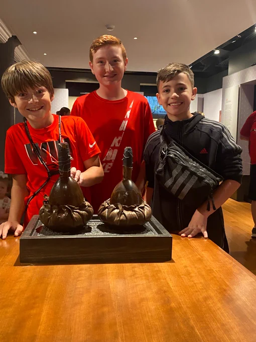 three students pose together for a picture