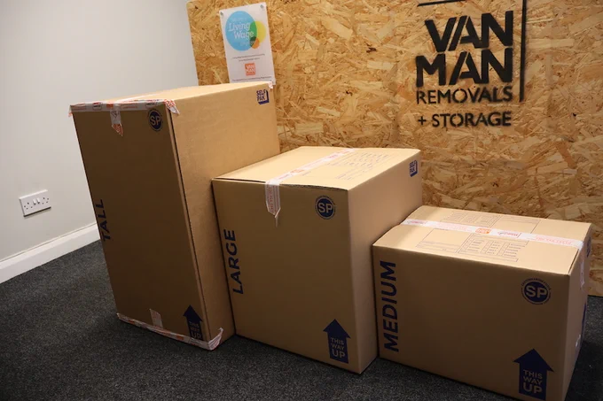 Cardboard removal boxes of various sizes on display