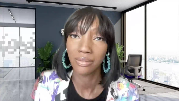 Screenshot of Ayanna Lott-Pollard's keynote. She is centered, wearing tuquoise hoop earrings, a blank top, and a colorful purple, white, black blazer. Behind her is a Zoom background with the RC logo.