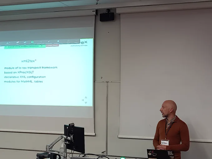 Martin presenting a slide “xml2tex” with the bullet points: Module of le-tex transpect framework; based on XProc/XSLT; Declarative XML configuration; Modules for MathML and tables