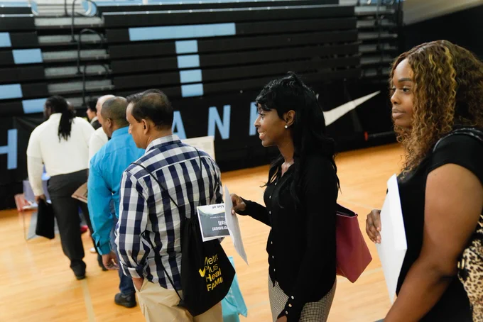 Job applicants wait on line for meetings