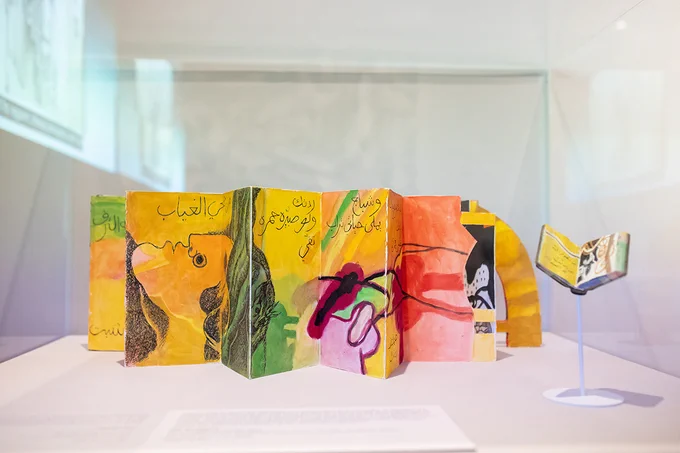 A photograph of bright dafatir on display in Dia al-Azzawi: Painting Poetry. 
