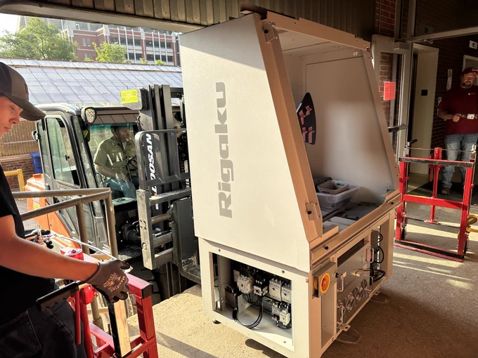 Forklift setting SmartLab instrument on the loading dock.