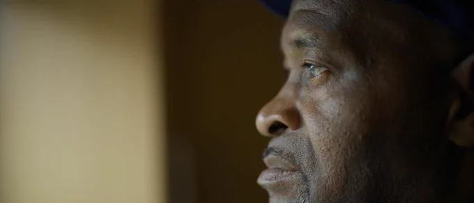 A still from award-winning documentary film 'Hostile' showing a person looking forwards. The film will be screened free on 28 June in Stratford as part of Newham Council's Windrush 75 programme. Image courtesy and copyright Sonita Gale