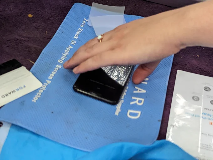 a phone with a fully applied screen protector