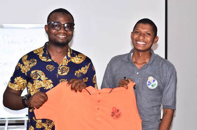 President of SuzaYouthMappers awards Zanzibar University vice-president youthmapper t-shirt 