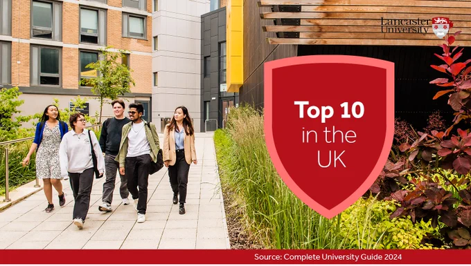 Photo of students walking by Margaret Fell Lecture Theatre on campus, accompanied by text: Top 10 in the UK