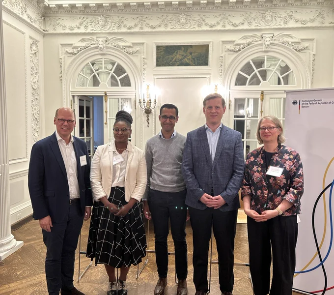 A group picture of the speakers, moderator, the a consul general and head of the German American Business Council of Boston.