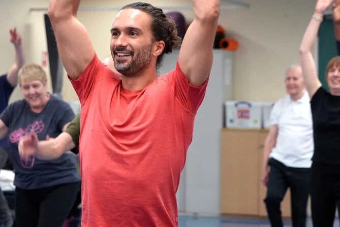 Photo of Joe Wicks in an exercise class