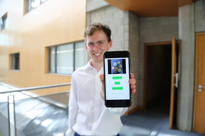 UL Student Jacob Beck with the coin counting application that he developed on his phone as part of the UPSTaRT summer research programme