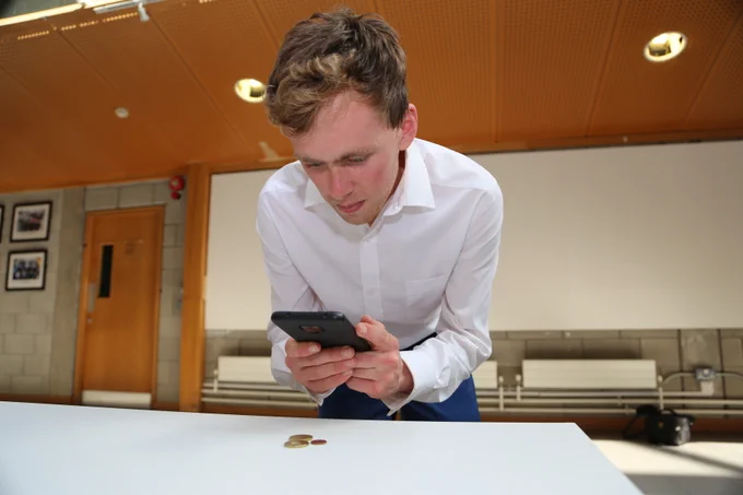 UL Student Jacob Beck with the coin counting application that he developed on his phone as part of the UPSTaRT summer research programme