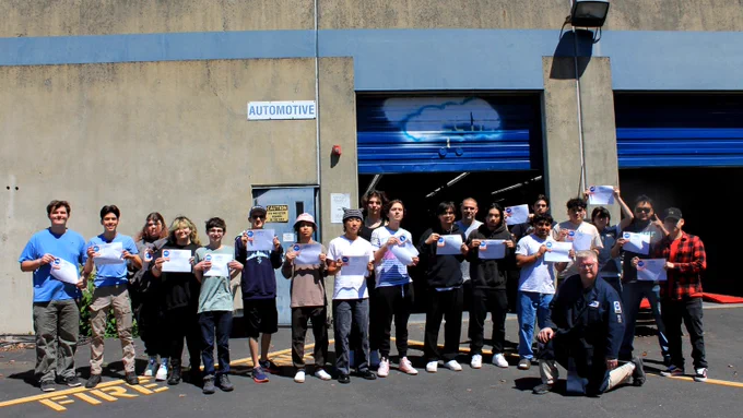 PSSC automotive students posing for photo with their certifications