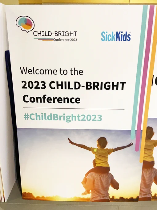 A child is sitting on her father's shoulders, arms outstretched. Text reads: Welcome to the 2023 CHILD-BRIGHT Conference