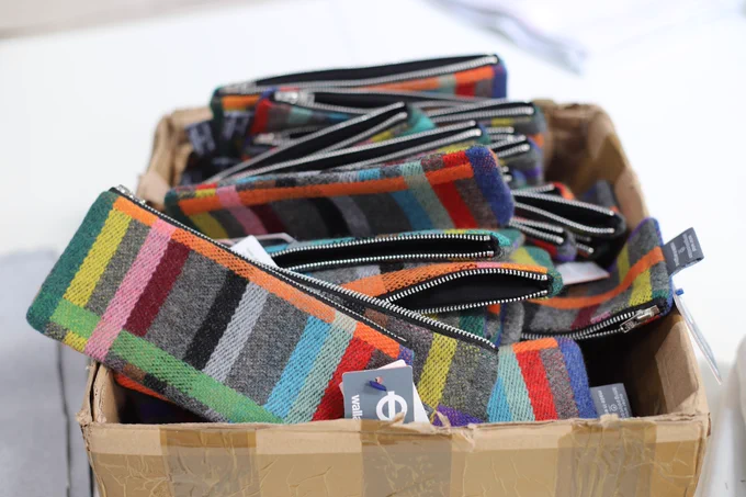 A box full of Pencil cases with the London Underground design.