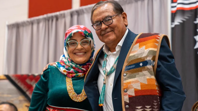 Navajo Technical University President Elmer Guy stands with Wafa Hozien. 
