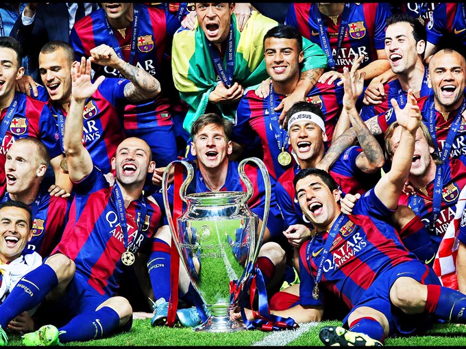 Javier Mascherano, Lionel Messi, Neymar, Luis Suarez, Sergio Busquets, and Daniel Alves of FC Barcelona posing with the Cup after winning the UEFA Champions League final match between Barcelona and Juventus on June 6, 2015, at the Olympic stadium in Berlin, Germany. Image: VI Images via Getty Images