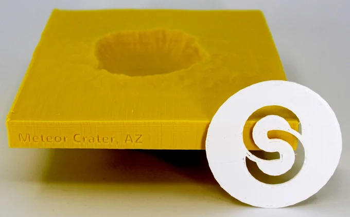 3D print of Meteor Crater with Scottsdale Community College logo.