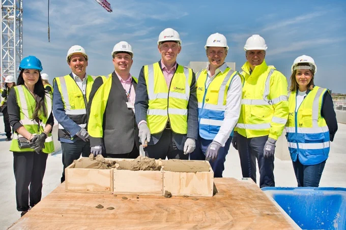 Pictured L-R: Ella Tsui-Lau, Assistant Principal at Wirral Met College; Peter Reavey, Regional Director of GRAHAM; Cllr Paul Stuart, Leader of Wirral Council; James Whittaker, Executive Director for Development at Peel L&P; Max Cawthorn, Head of PIC Capital Strategy; Steve Rotheram, Metro Mayor of the Liverpool City Region; and Catherine Holmes, Head of Cities and Major Conurbations at Homes England. Photo courtesy of Peel L&P